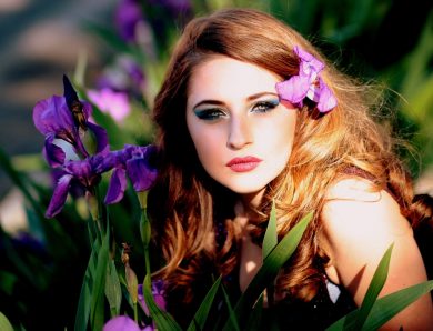Beautiful lady on purple flower is amazed